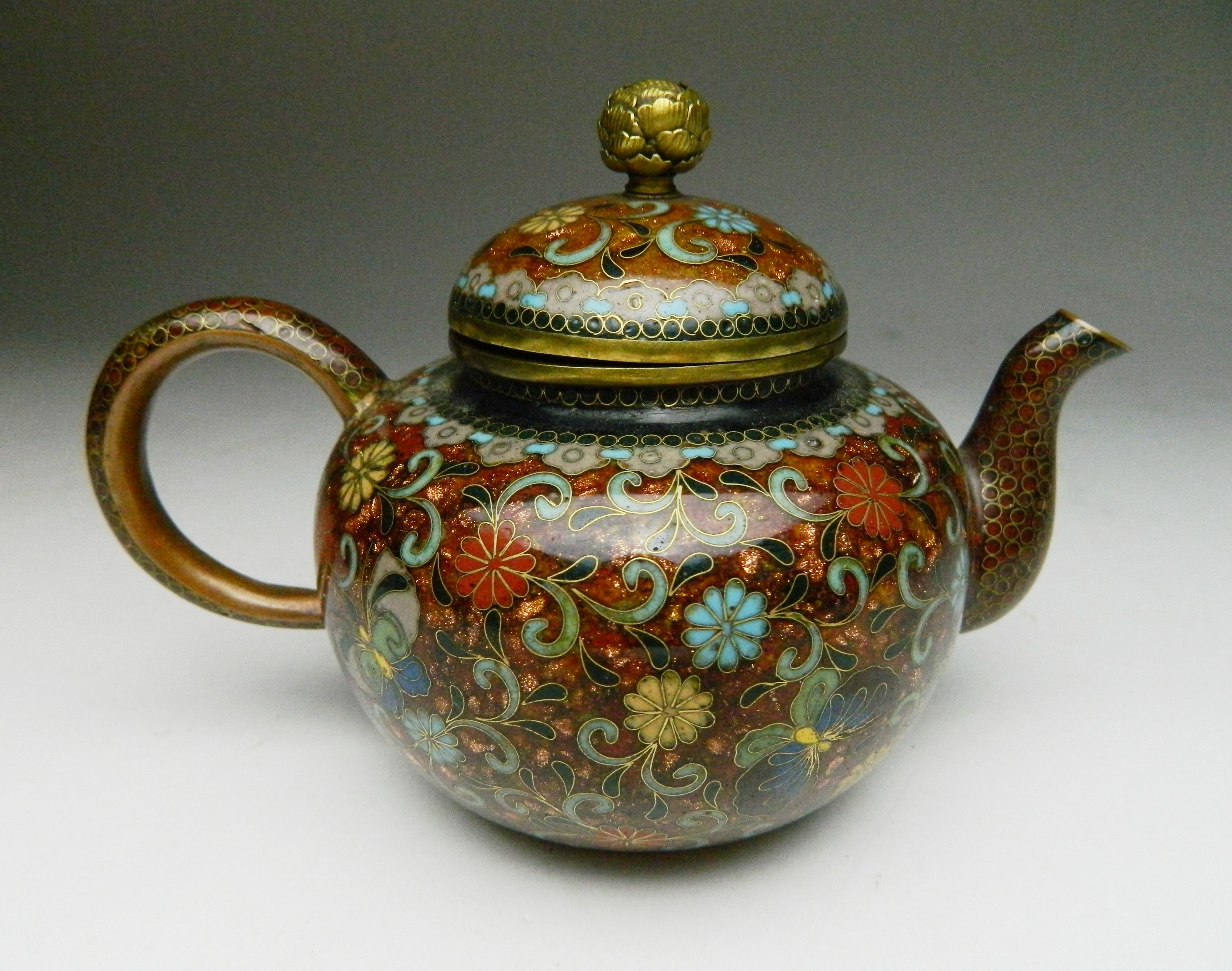 Appraisal: Japanese cloisonne teapot- phoenix and butterfly motif on patterned brown