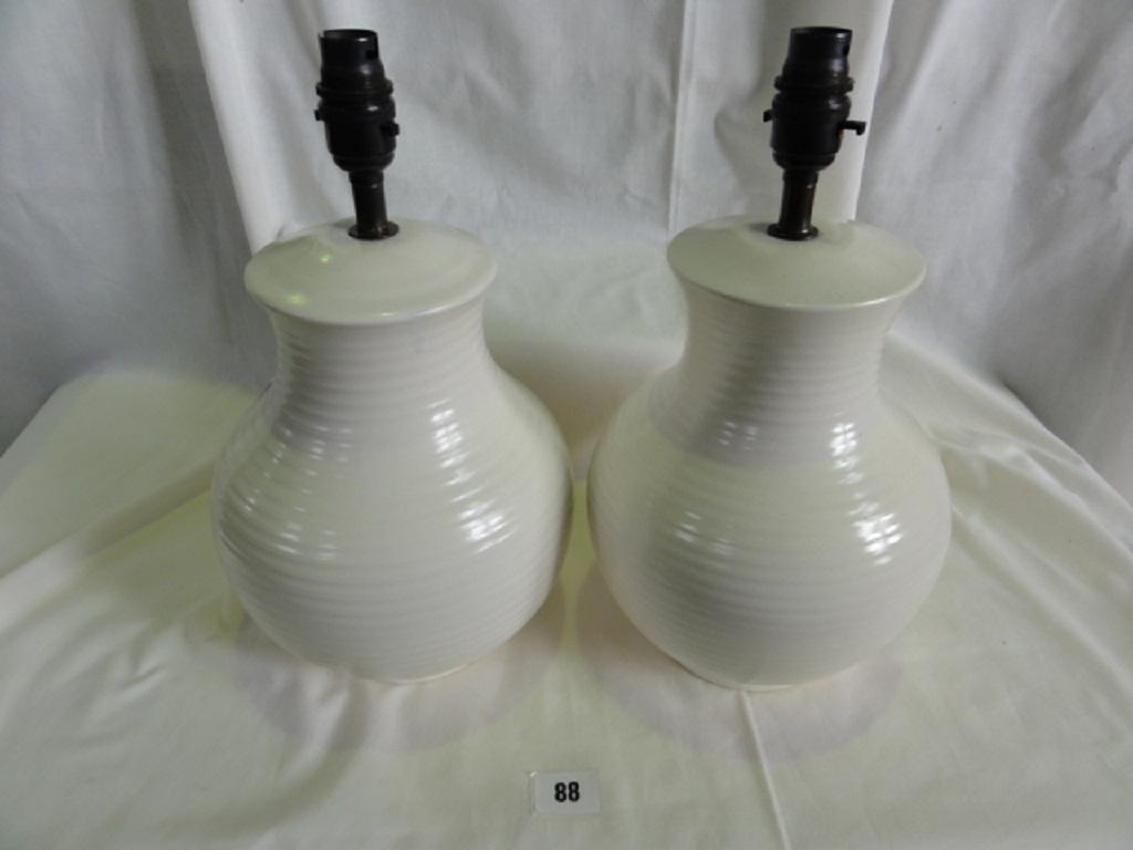 Appraisal: A pair of cream glazed Moorcroft lamp bases with ridged