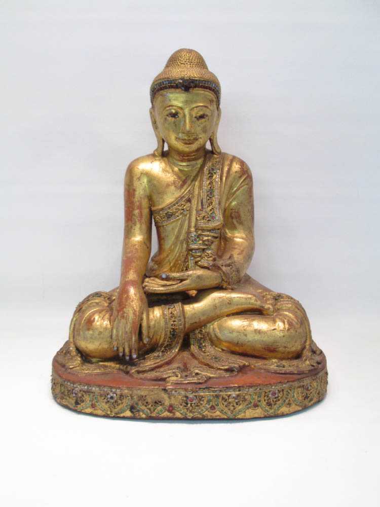 Appraisal: SOUTHWEST ASIAN GILT CARVED WOOD BUDDHA in a seated position