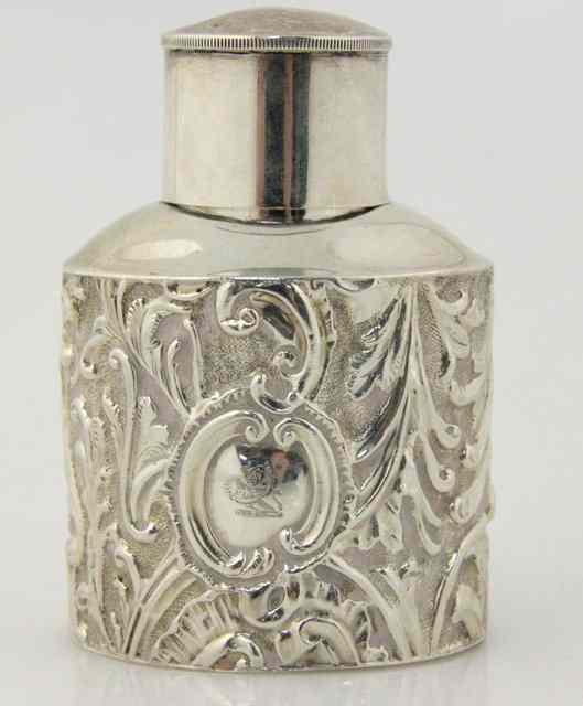 Appraisal: A small silver tea caddy London of oval form embossed