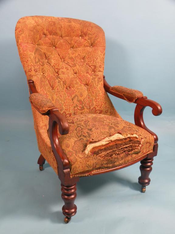 Appraisal: A Victorian mahogany button back armchair on turned legs with