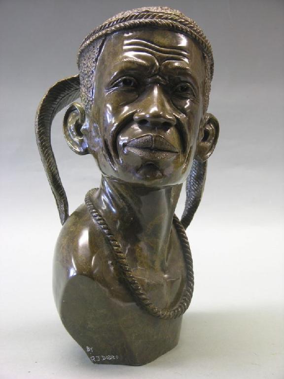 Appraisal: A carved mineral portrait bust of an Aborigine signed R