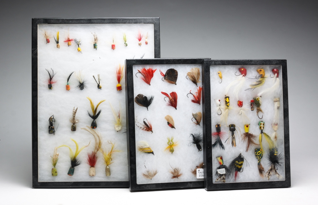 Appraisal: ASSORTED FLY FISHING LURES IN DISPLAY CASES American th century