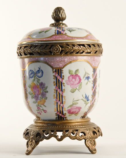 Appraisal: A Continental Porcelain Lidded Cachepot with gilt brass mountings and