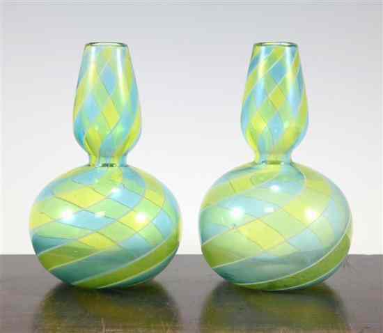 Appraisal: A pair of unusual three colour spiral glass bottle vases