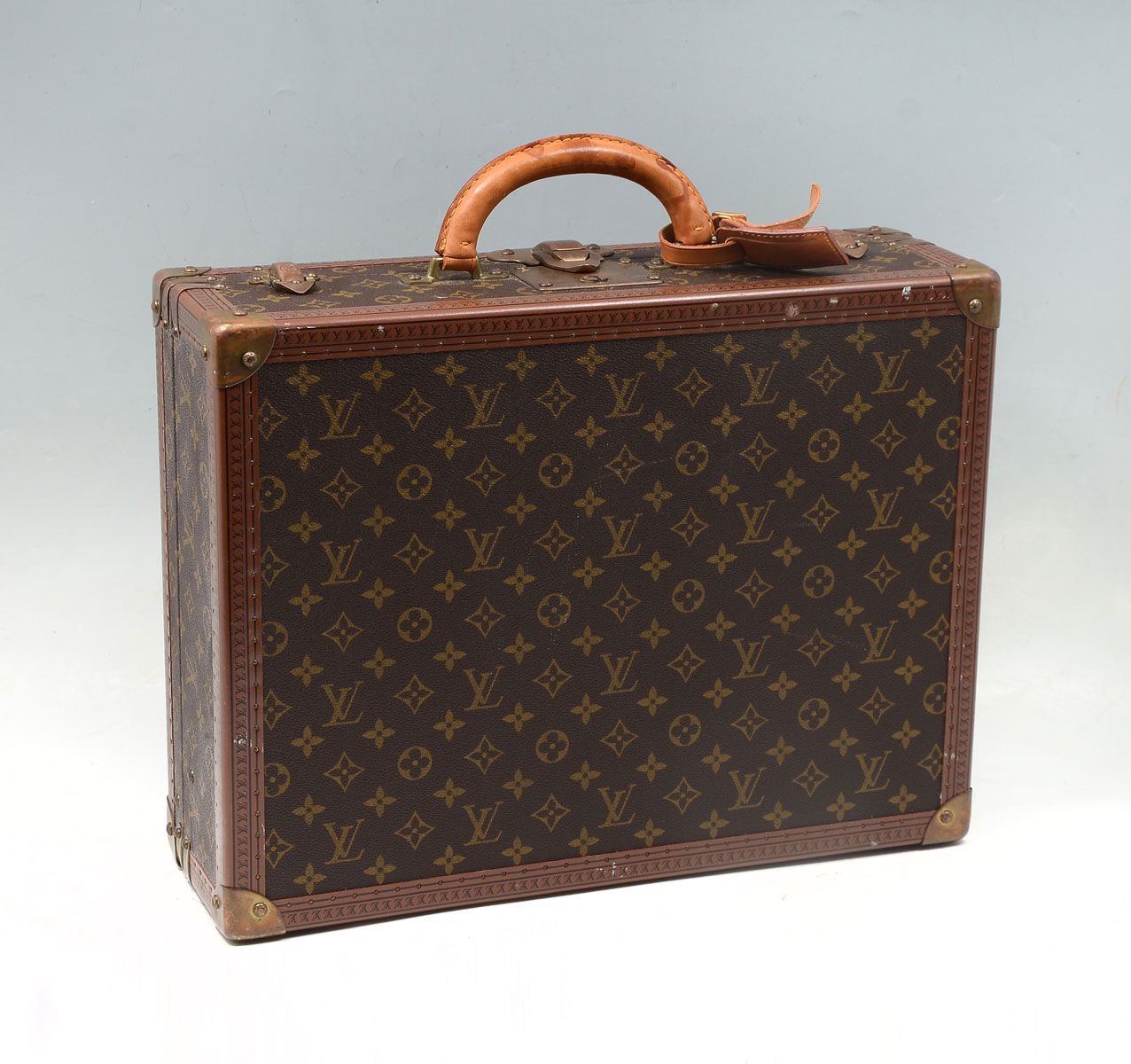 Appraisal: RARE SMALL VINTAGE LOUIS VUITTON SUITCASE Canvas and leather hard