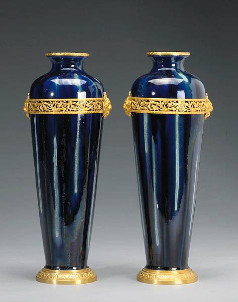 Appraisal: A pair of French cobalt flamb glazed pottery gilt bronze