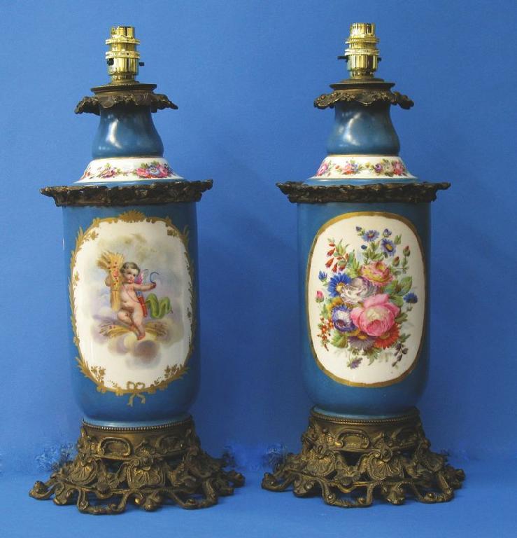 Appraisal: A PAIR OF VICTORIAN SEVRES STYLE TABLE LAMPS the cylindrical