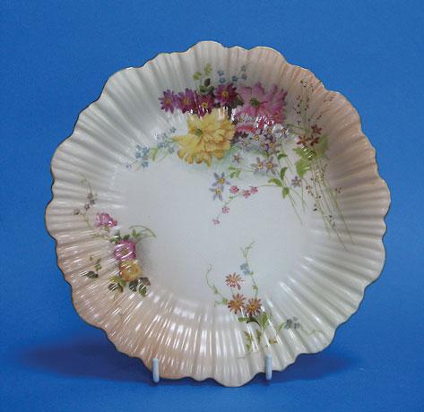 Appraisal: A ROYAL WORCESTER BLUSH IVORY PLATE the frilled border with