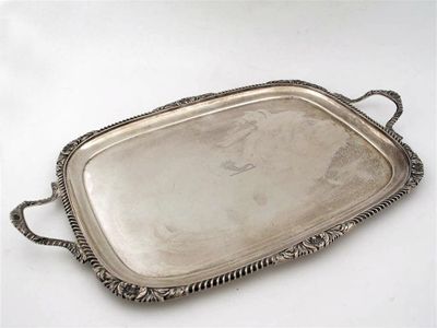 Appraisal: An Edwardian two handled tea tray of rounded oblong form