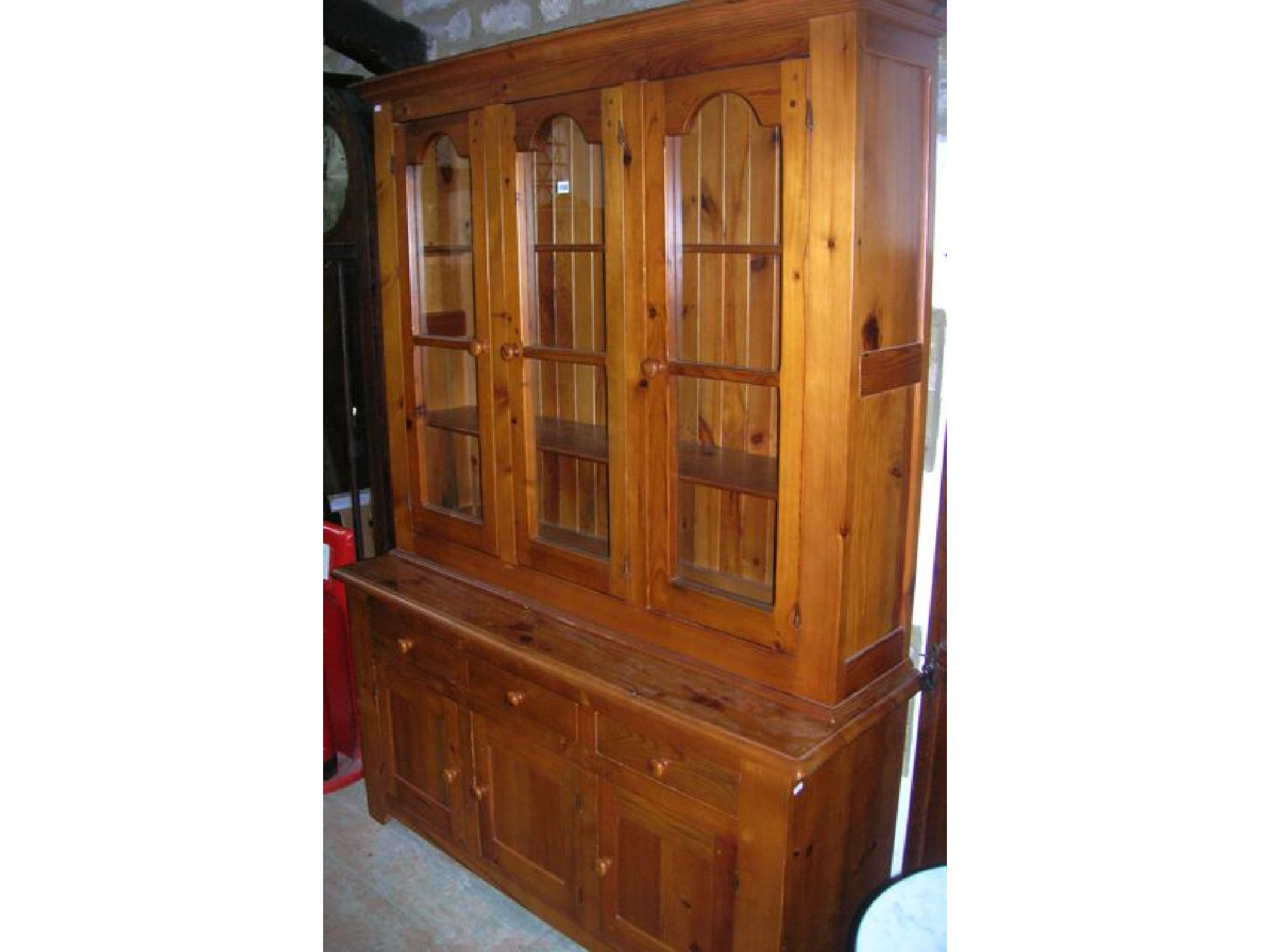 Appraisal: A pine kitchen dresser the lower section enclosed by three