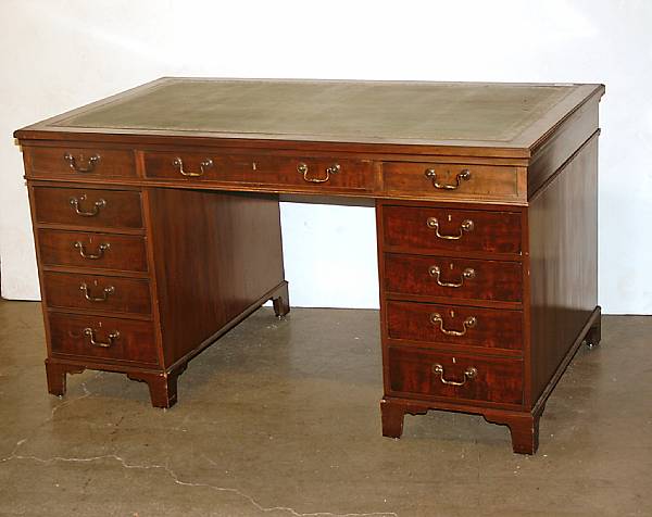 Appraisal: A George III style mahogany partner's desk height in width