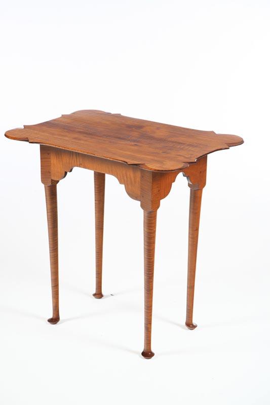 Appraisal: QUEEN ANNE-STYLE TEA TABLE American th century curly maple Shaped