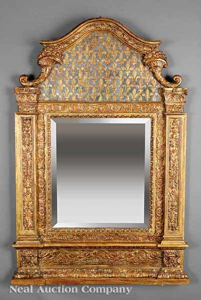 Appraisal: A Highly Carved and Gilded Tabernacle Mirror arched crest with