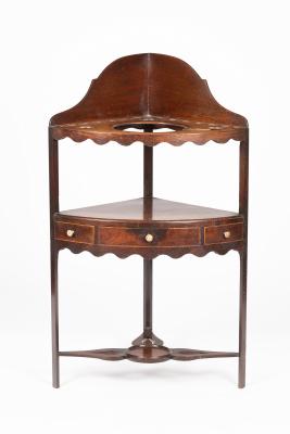 Appraisal: A George III mahogany corner washstand fitted a glass bowl