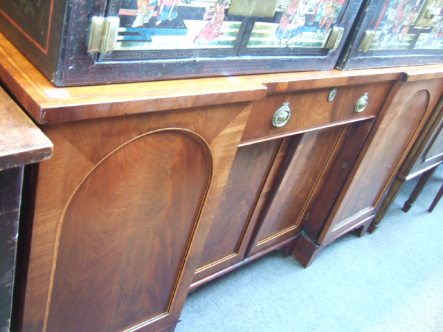 Appraisal: A Regency mahogany and satinwood banded sideboard the reverse breakfront