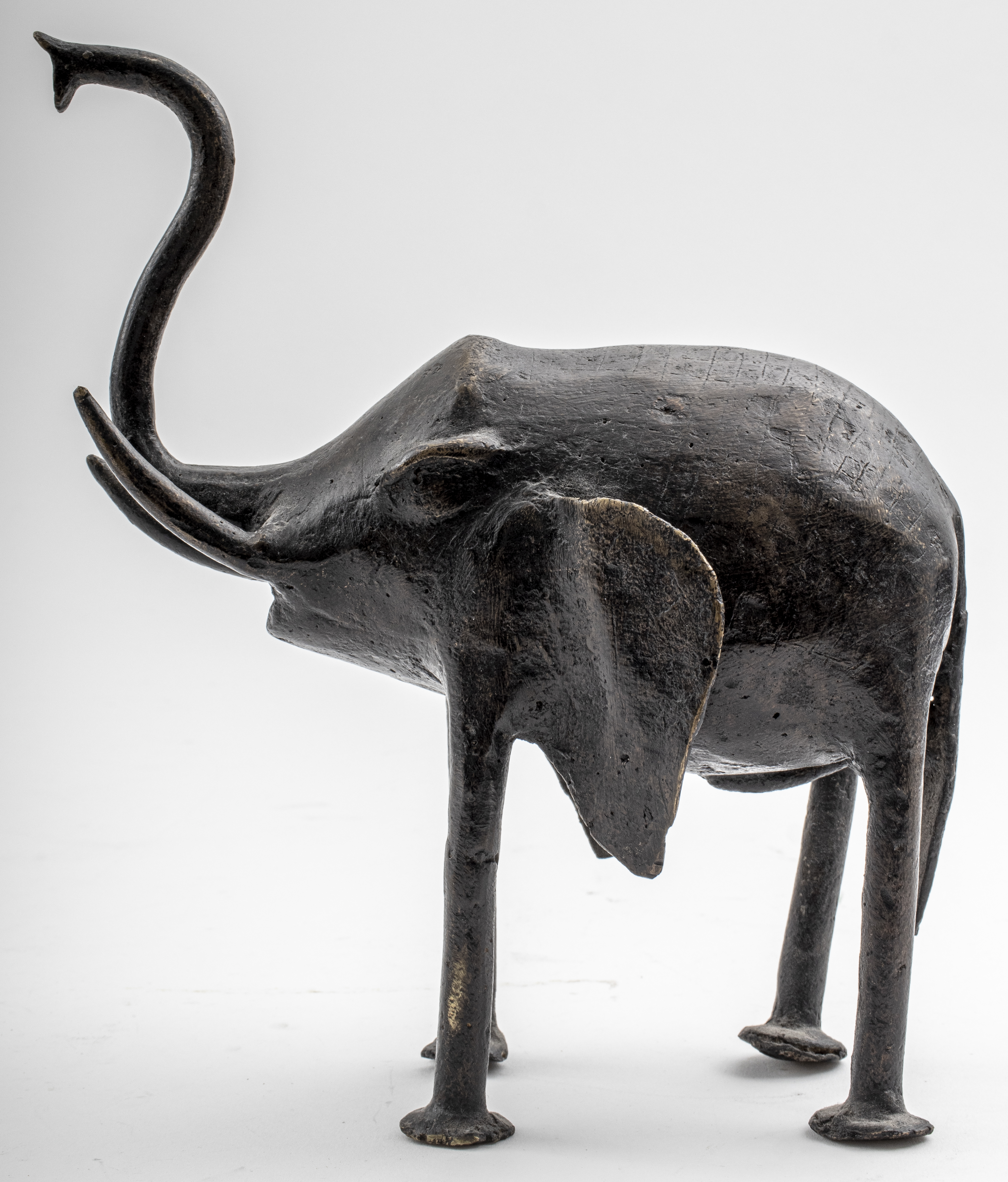 Appraisal: BRONZE STYLIZED ELEPHANT SCULPTURE Bronze stylized elephant sculpture unmarked H