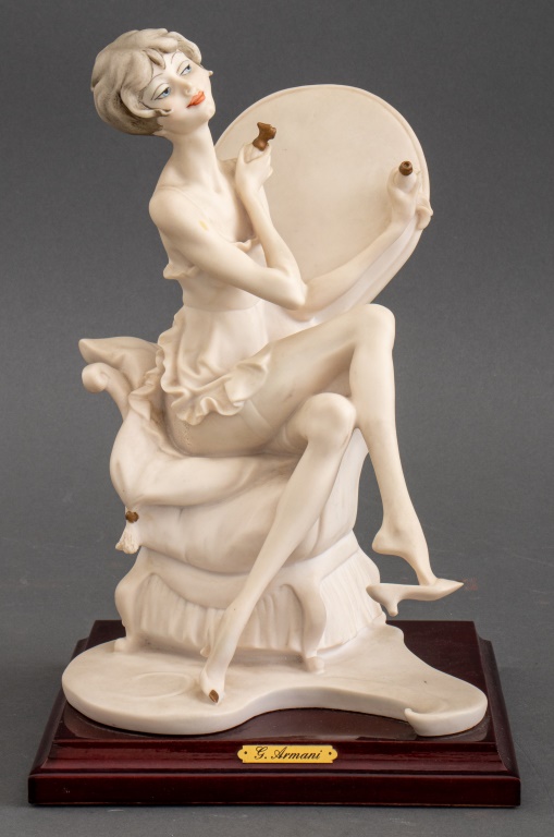 Appraisal: GIUSEPPE ARMANI LADY ON CHAIR PORCELAIN FIGURE Giuseppe Armani Italian