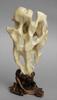 Appraisal: CHINESE CREAM MARBLE SCHOLAR'S ROCK Of natural form pierced with