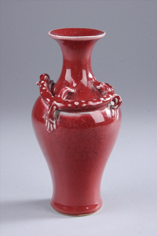 Appraisal: CHINESE COPPER RED PORCELAIN VASE Jiaqing period Molded qilin in