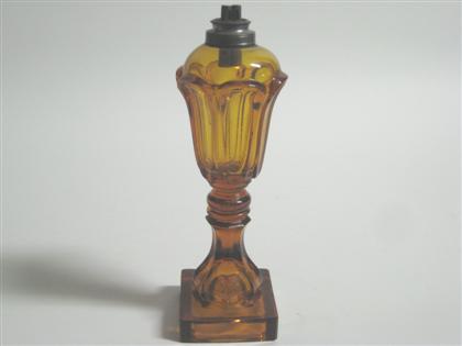 Appraisal: Amber pressed glass fluid lamp boston and sandwich glass company