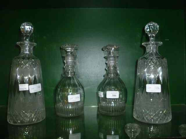 Appraisal: A PAIR OF GEORGIAN GLASS RING NECK DECANTERS with bulbous