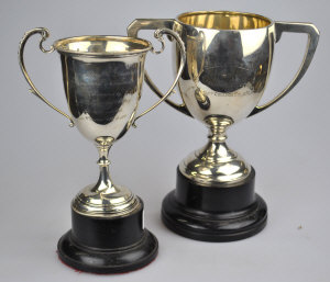 Appraisal: Two silver two-handles trophy cups oz on ebonised socles