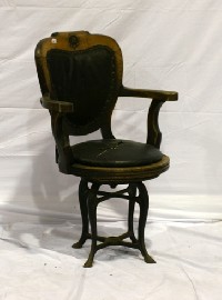 Appraisal: An oak and iron captain's chair marked for Empreza Nacional