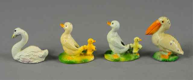 Appraisal: PELICAN AND SWANS PAPERWEIGHTS Hubley includes swan pelican with ''Clearwater