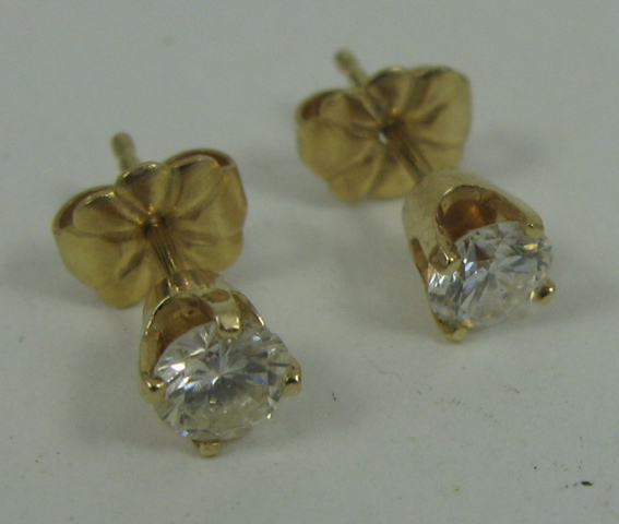 Appraisal: PAIR OF DIAMOND AND FOURTEEN KARAT GOLD EAR STUDS each