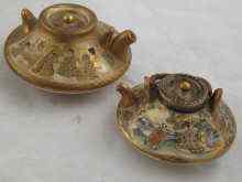 Appraisal: Two Japanese miniature teapots finely decorated and gilded x cm