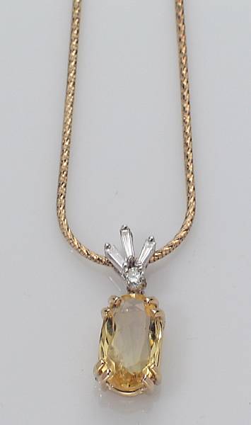 Appraisal: A yellow sapphire diamond and k gold pendant on a