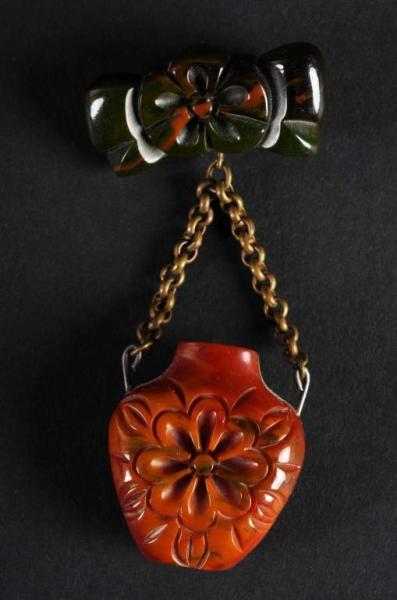 Appraisal: Bakelite Green Flower Pin with Hanging Brown Vase Condition Excellent