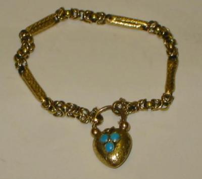 Appraisal: A VICTORIAN GOLD BRACELET comprising scroll moulded barrel links between