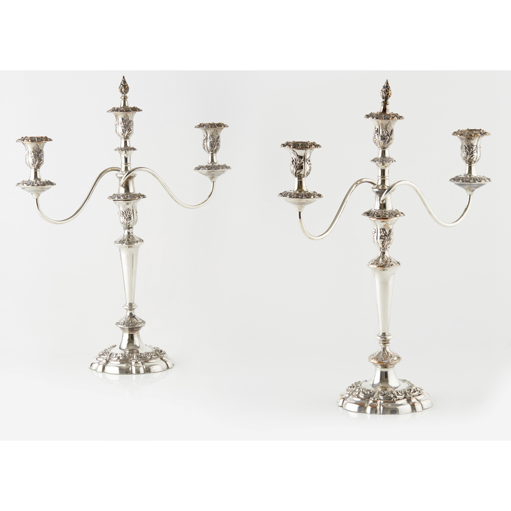 Appraisal: A pair of Sheffield plated three light candelabra the central