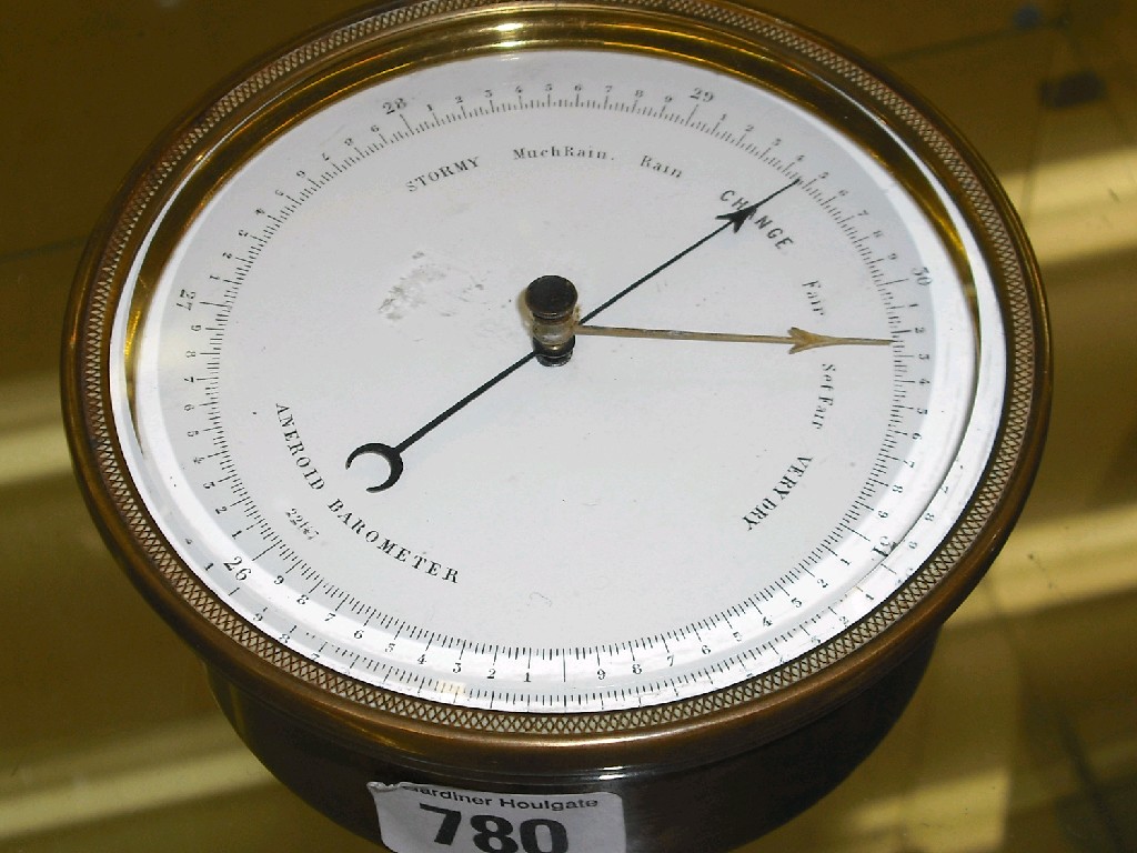 Appraisal: Small circular brass aneroid barometer the white dial within a