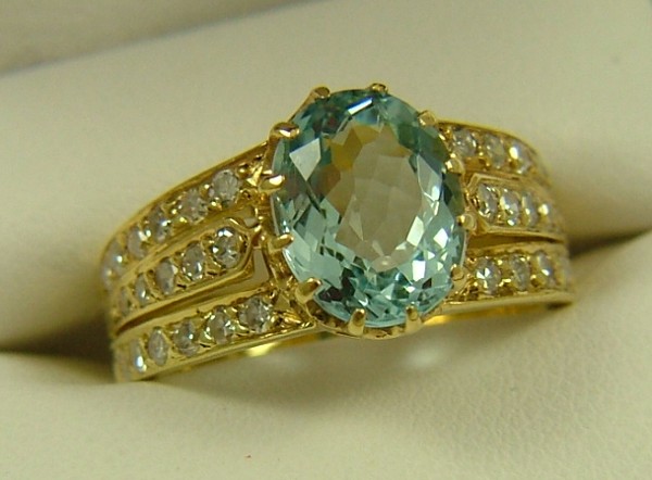 Appraisal: BLUE TOPAZ AND DIAMOND RING K yellow gold setting estimated