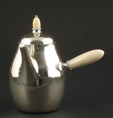 Appraisal: A Georg Jensen silver and ivory coffee pot and cover