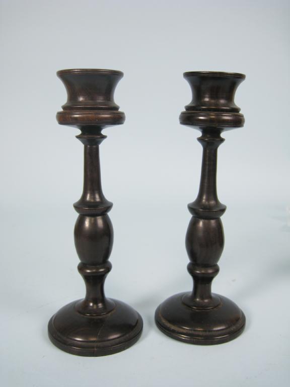 Appraisal: Pair of Regency style coromandel turned wood Candlesticks in high