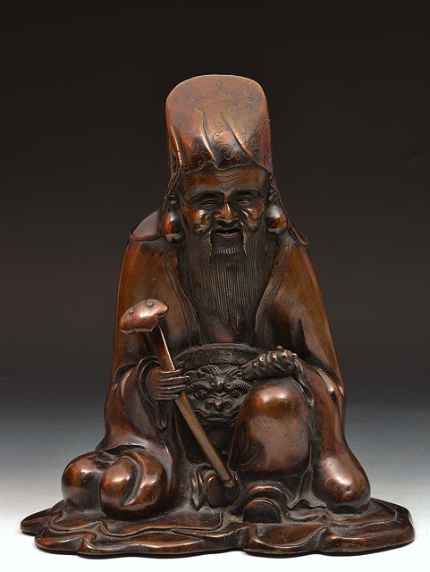 Appraisal: Japanese bronze seated figure of Jurojinholding a scroll and ruyi