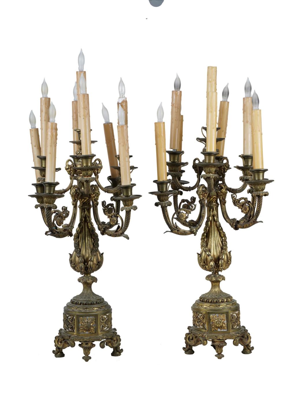 Appraisal: PAIR OF NINE-LIGHT BRONZE CANDELABRAelectrified as table lamps inches high