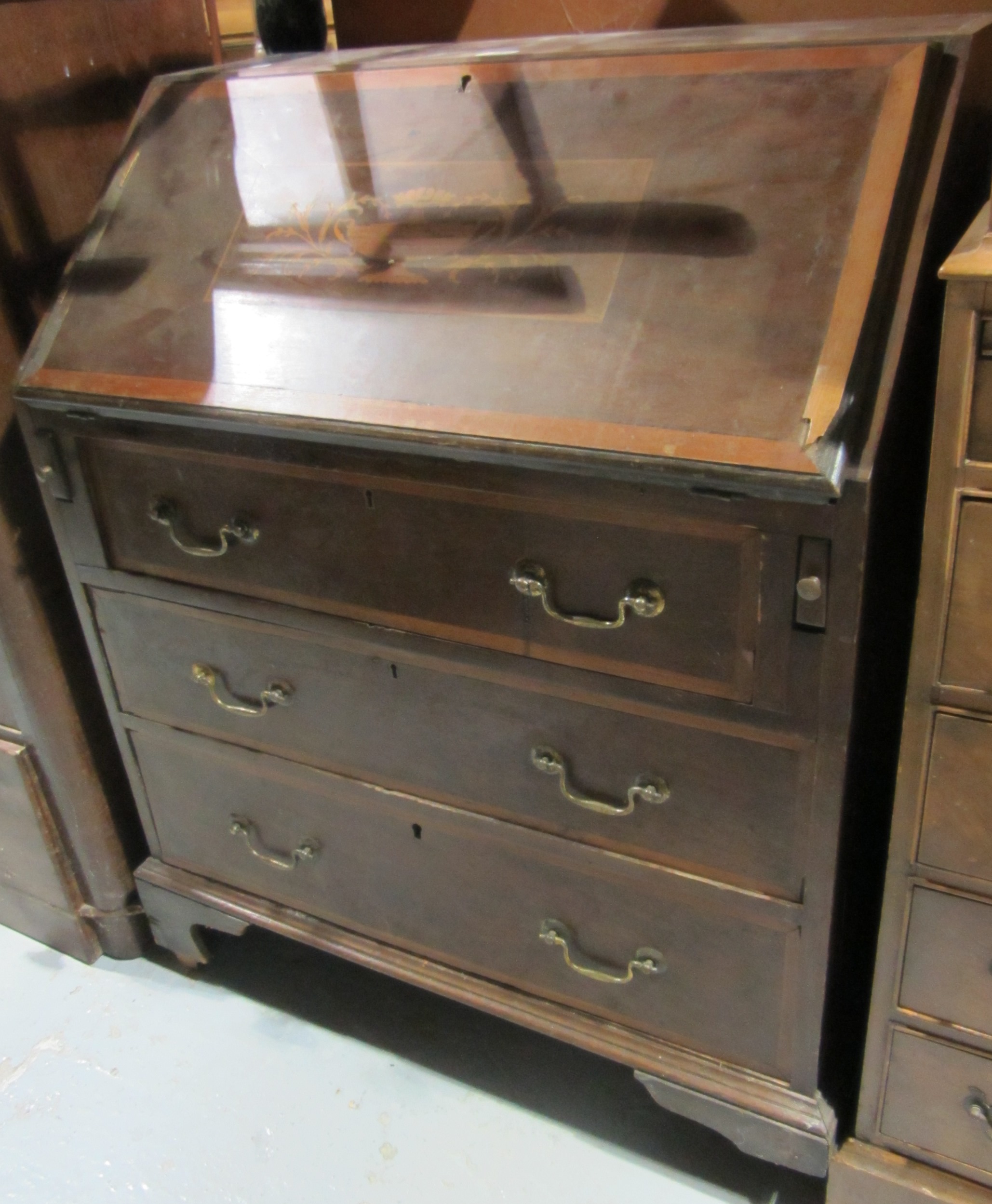 Appraisal: A th century mahogany inlaid bureau