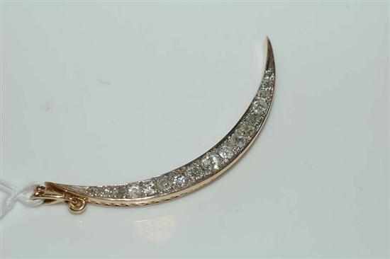 Appraisal: A CRESCENT MOON DIAMOND SET PENDANT TESTED CT GOLD