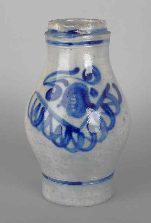 Appraisal: German stoneware pitcher th c with a cobalt floral decoration