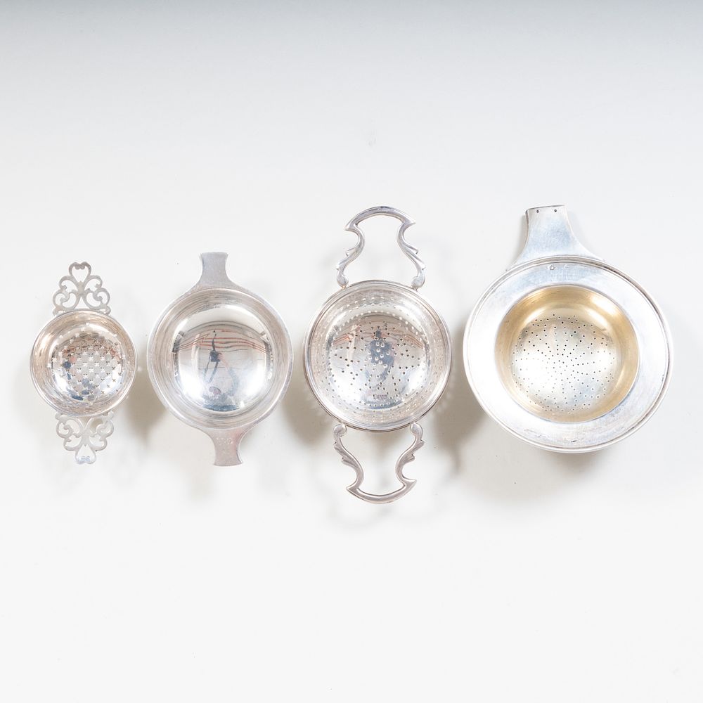 Appraisal: Three British Silver and a Hungarian Tea Strainers Comprising A