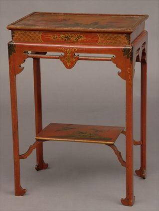 Appraisal: CHINOISERIE-STYLE RED LACQUER END TABLE The tray top with gilt