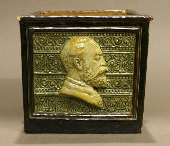 Appraisal: A Doulton Lambeth stoneware square form jardiniere with modelled portraits