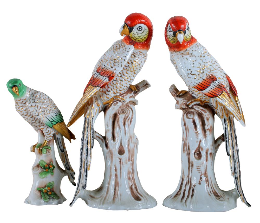 Appraisal: THREE PORCELAIN PARROT FIGUREScomprising a pair with orange feathers unmarked