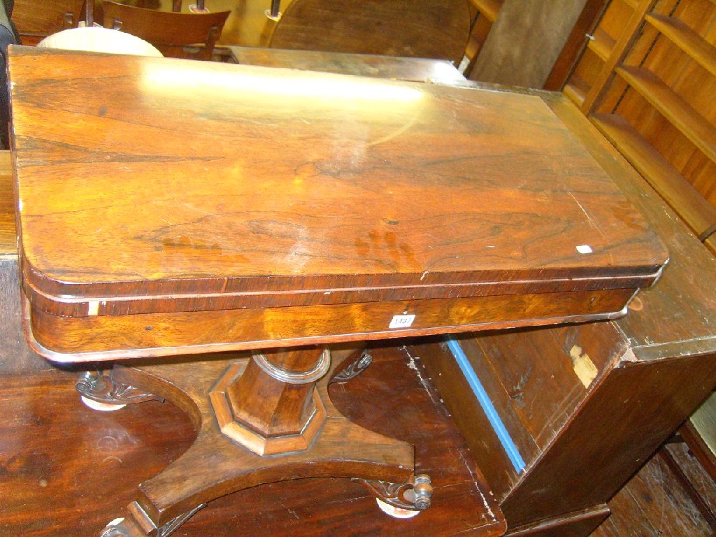 Appraisal: A Regency rosewood fold over topped card table raised on