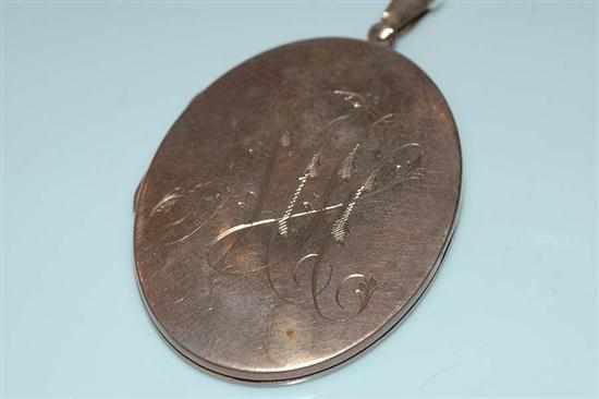 Appraisal: AN OVAL ENGRAVED LOCKET STAMPED CT GOLD